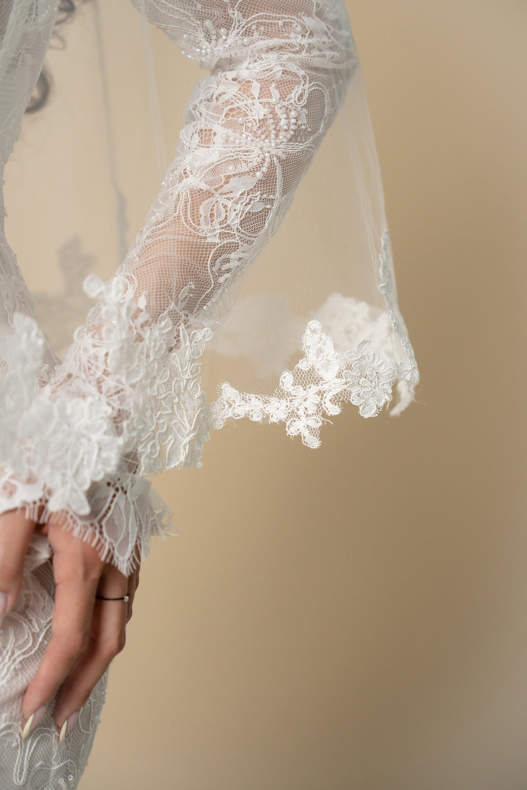 Close-up of the Agatha short wedding veil featuring handcrafted 3D floral lace by Aoura Veil