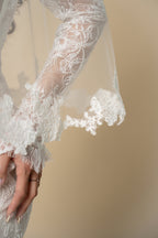 Close-up of the Agatha short wedding veil featuring handcrafted 3D floral lace by Aoura Veil