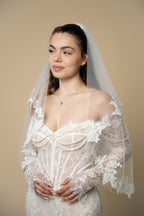 Bride wearing the Agatha short wedding veil with elegant 3D floral lace by Aoura Veil