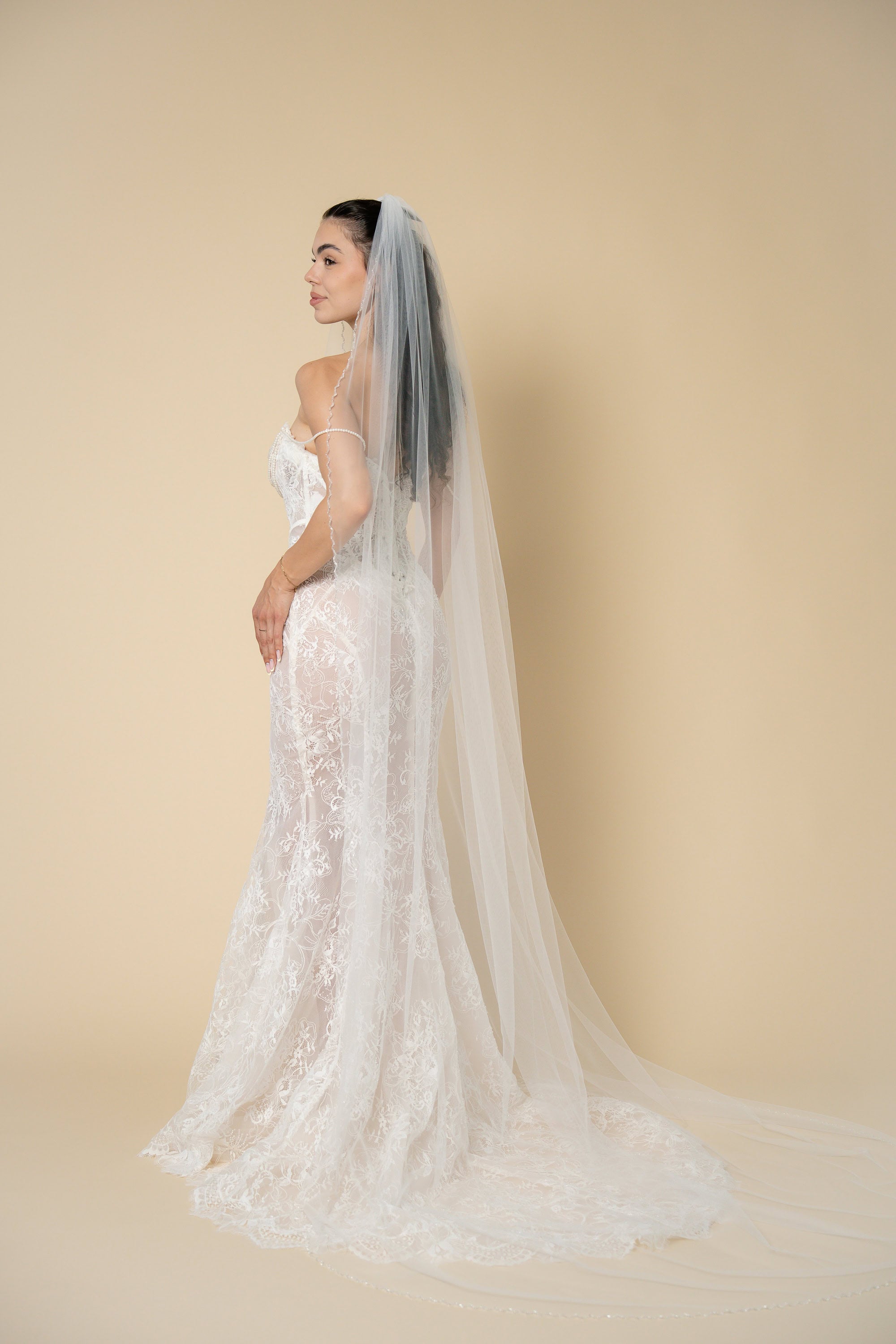 Back view of the Ava cathedral wedding veil featuring handcrafted glass crystal edging by Aoura Veil