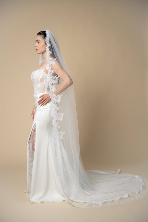 Beverly cathedral wedding veil featuring wide sequined eyelash lace handcrafted by Aoura Veil
