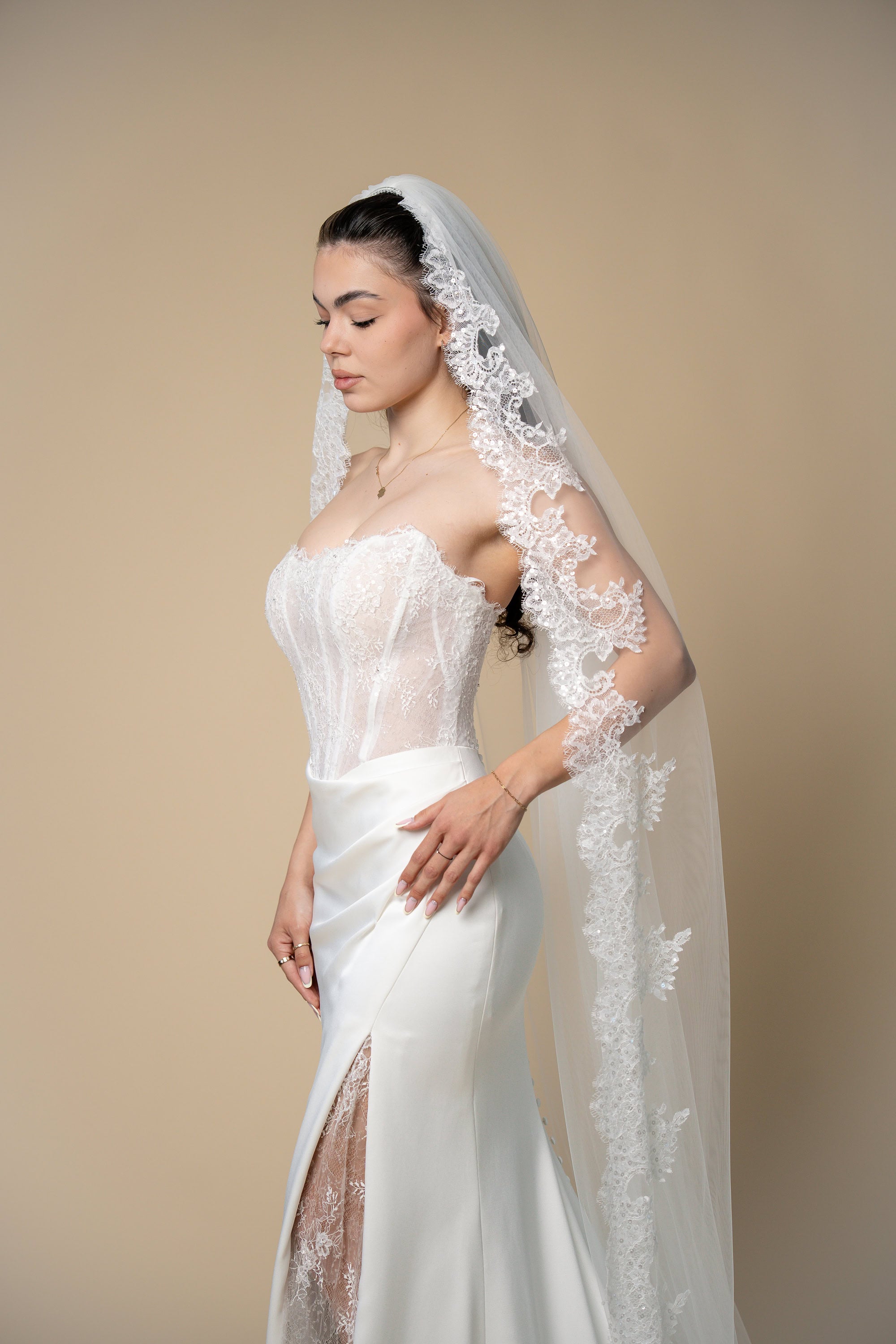 Side view of Beverly cathedral bridal veil with luxurious wide sequined lace border