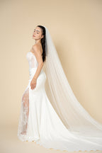 Emira cathedral wedding veil featuring a V-shaped pearl and crystal edge handcrafted by Aoura Veil