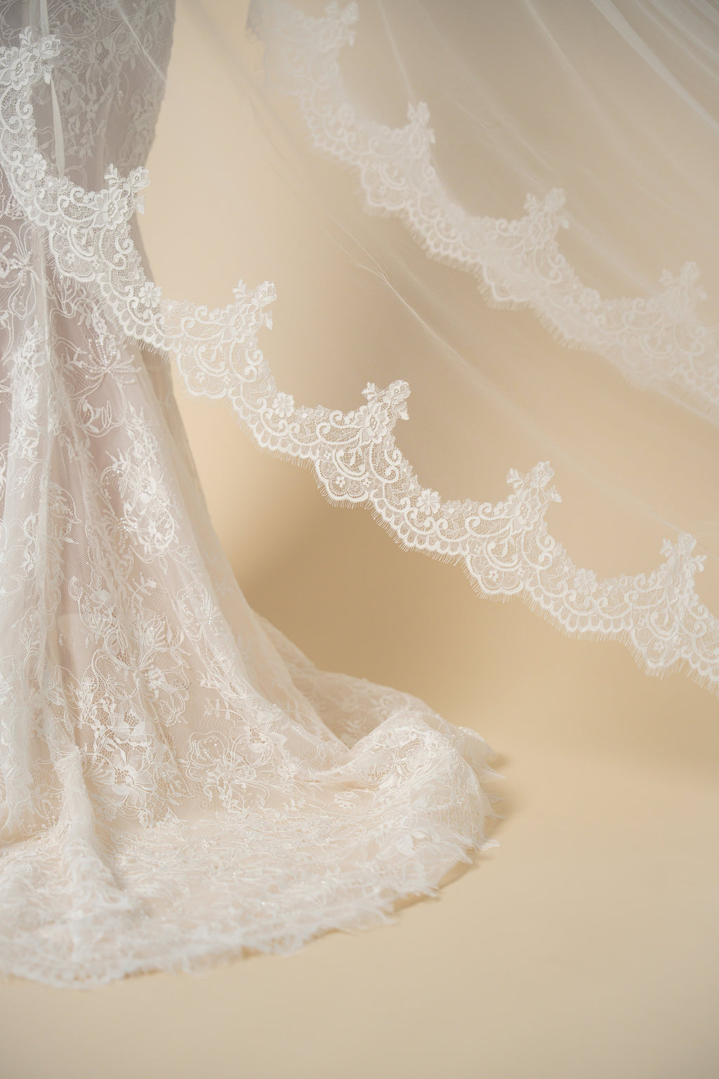 Close-up detail of the Freya cathedral wedding veil featuring luxurious scalloped lace with eyelash fringe
