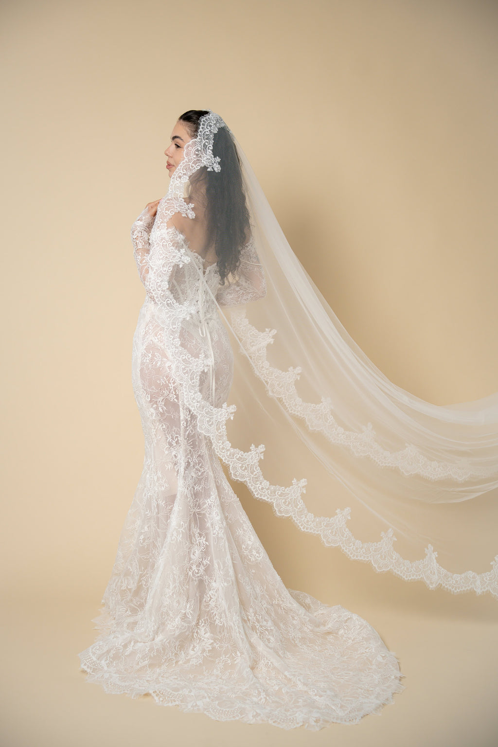 Side profile of the Freya cathedral wedding veil with luxury scalloped U-shaped lace handcrafted by Aoura Veil