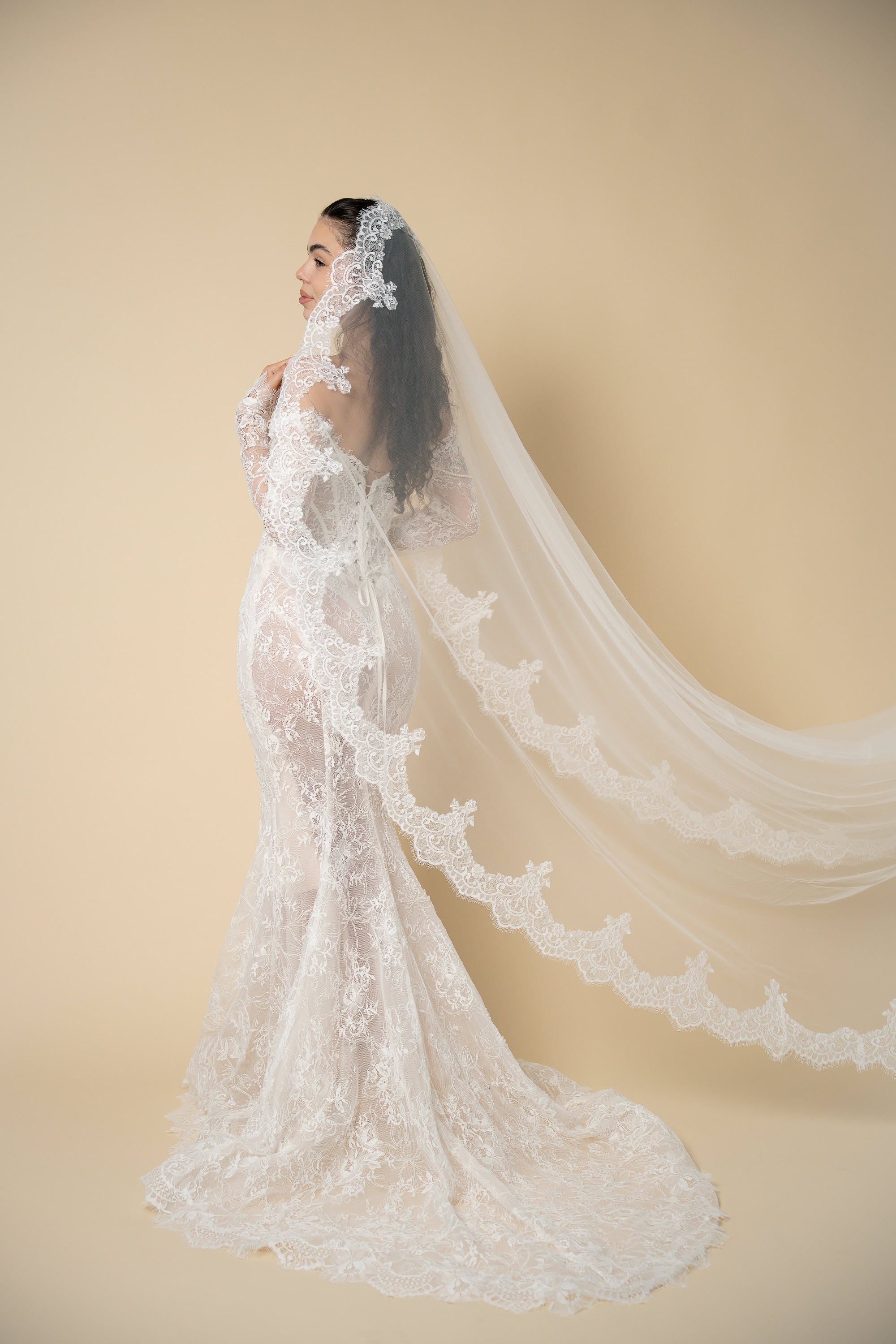 Side profile of the Freya cathedral wedding veil with luxury scalloped U-shaped lace handcrafted by Aoura Veil