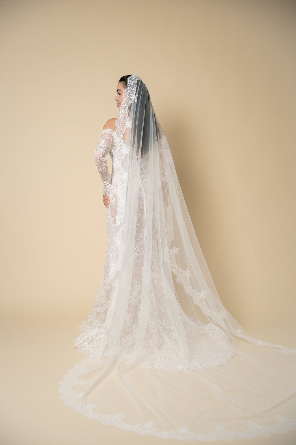 Back view of the Freya cathedral wedding veil featuring luxurious U-shaped lace with elegant eyelash fringe