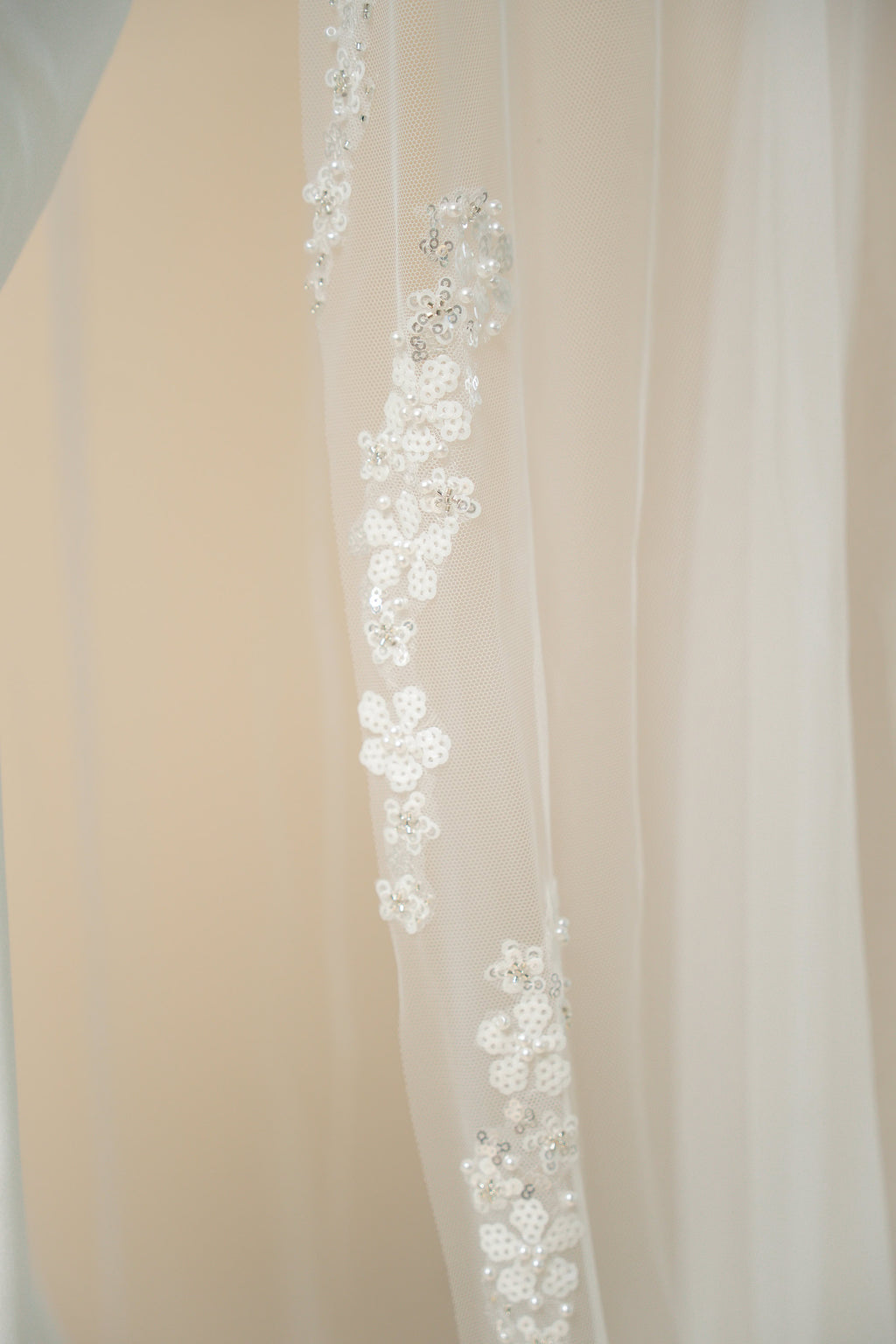 Close-up of hand-sewn floral strands on Hellen cathedral wedding veil