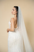 Close-up of the Ivana bridal veil showcasing delicate crystal embellishments evenly distributed across the entire veil by Aoura Veil