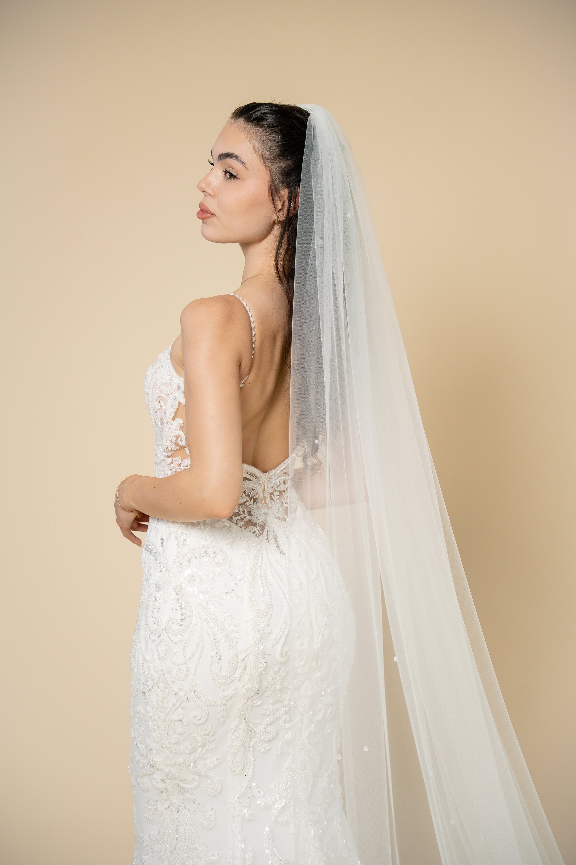 Close-up of the Ivana bridal veil showcasing delicate crystal embellishments evenly distributed across the entire veil by Aoura Veil