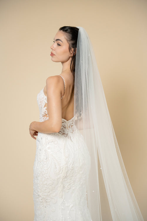 Close-up of the Ivana bridal veil showcasing delicate crystal embellishments evenly distributed across the entire veil by Aoura Veil