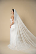 Back view of the Jolie minimalist cathedral wedding veil featuring graceful flowing tulle without embellishments by Aoura Veil