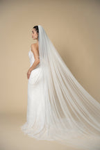 Back view of the Jolie minimalist cathedral wedding veil featuring graceful flowing tulle without embellishments by Aoura Veil