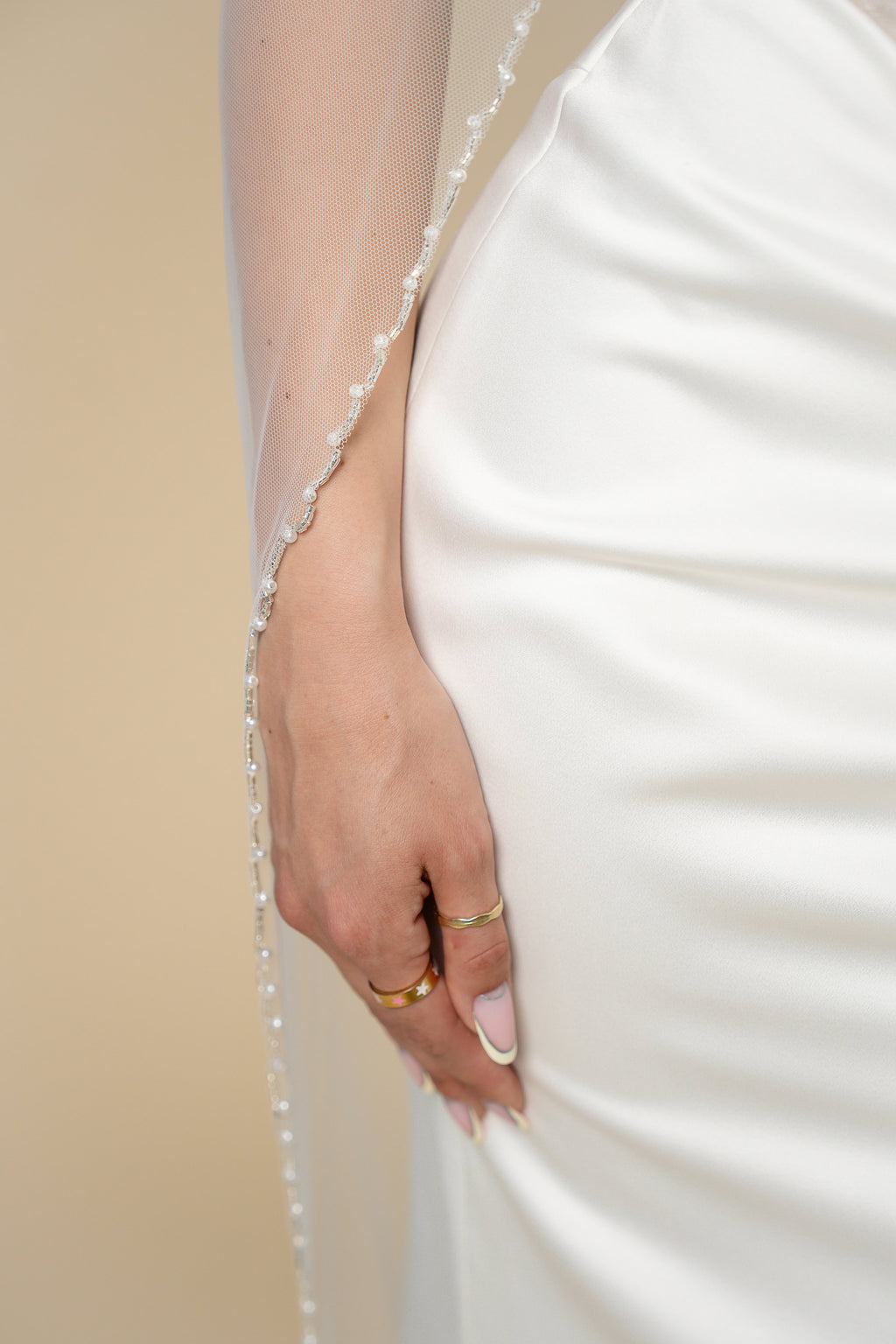 Close-up of pearl edge on Kelly cathedral bridal veil