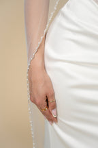 Close-up of pearl edge on Kelly cathedral bridal veil