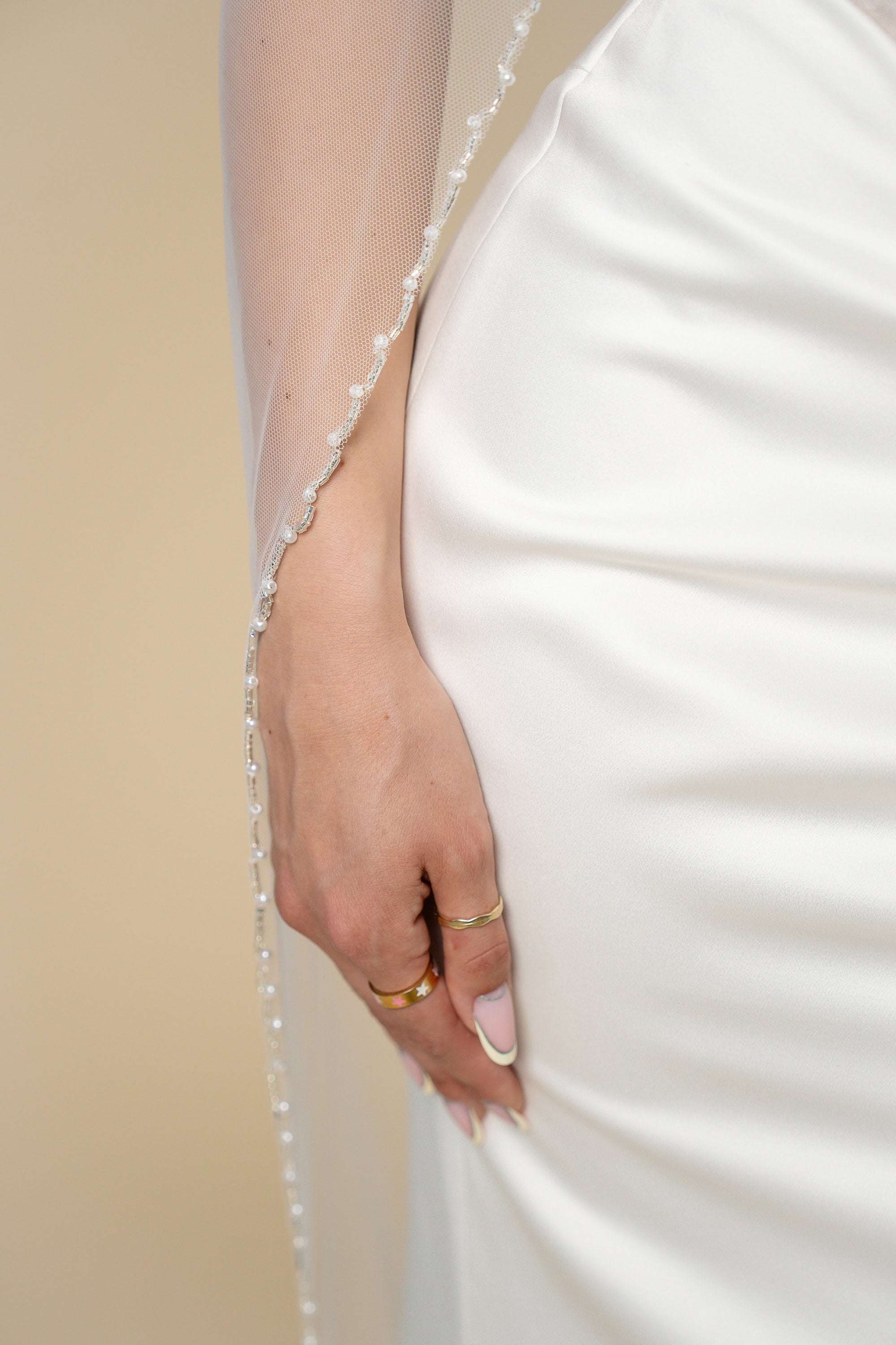 Close-up of pearl edge on Kelly cathedral bridal veil
