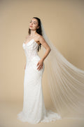 Luxury Poppy cathedral wedding veil featuring scattered pearl clusters throughout the full length of the veil by Aoura Veil