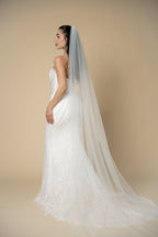 Back view of the Poppy pearl cathedral wedding veil featuring delicate pearl clusters throughout the veil by Aoura Veil
