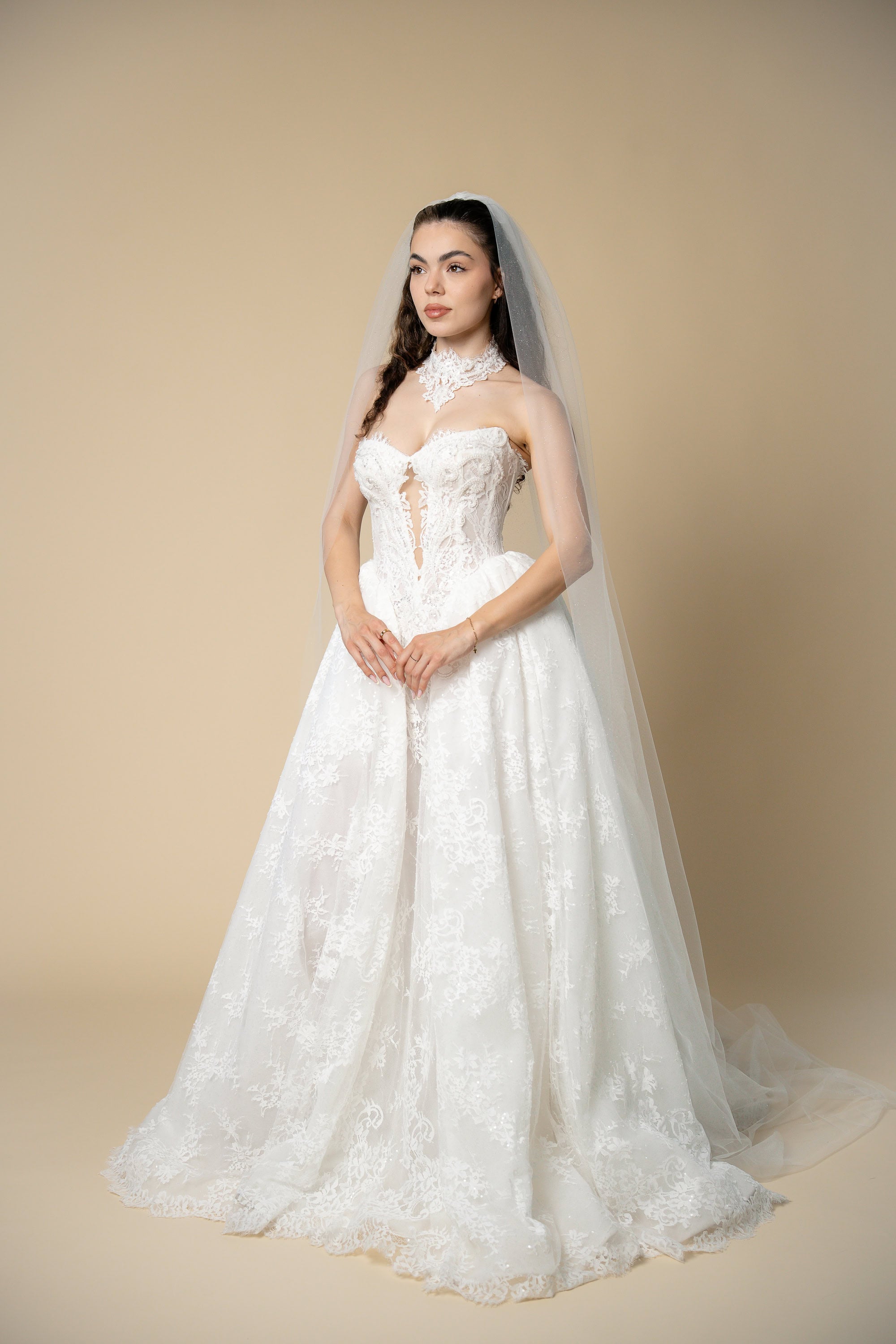 Bride wearing the Serena glitter cathedral wedding veil with elegant shimmer throughout the veil by Aoura Veil