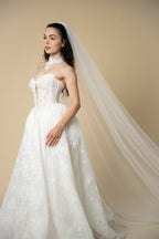 Side view of the Serena glitter cathedral wedding veil featuring delicate sparkle across the entire length by Aoura Veil