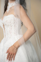 Close-up of the Serena bridal veil showcasing fine glitter delicately scattered across the entire tulle by Aoura Veil