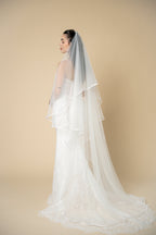 Close-up of the Vivian bridal veil highlighting the delicate white satin trim along the edge by Aoura Veil